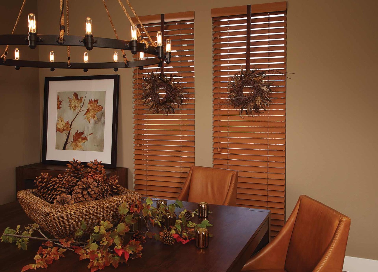 Hunter Douglas Parkland® Wood Blinds hanging in a home with natural accents